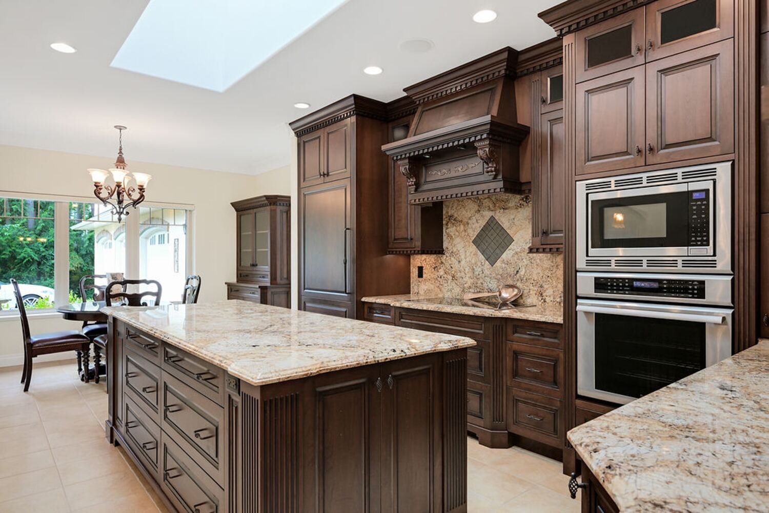 Central kitchen with island and stone counters